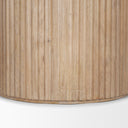 Detailed view of the Mylo Dining Table pedestal, highlighting its smooth rounded form and subtle natural wood texture.
