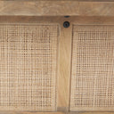 Macro view of natural woven rattan mesh inserts on Lachlan solid wood coffee table base
