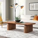 Nelson solid wood sled coffee table with thick rounded slab legs in a modern living room