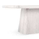Detailed close-up of the whitewashed Langston Dining Table highlighting the tabletop edge and tapered pedestal construction.