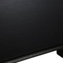 Close-up of the black Byron dining table leg highlighting the vertical wood grain and solid panel construction.