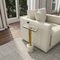 Caspian Bone Inlay End Table - decorative end table with a patterned rectangular top and gold-tone pedestal base beside a sofa.