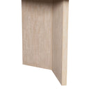 Close-up of the natural wood Byron dining table showing the rounded tabletop edge, textured wood finish, and panel leg.