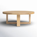 Blaise solid wood round coffee table straight side angle view