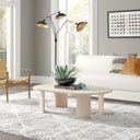 Jefferson oval light wood coffee table with curved panel slab legs in a bright living room