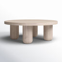 Vicente round light oak coffee table side profile view showcasing thick pillar legs