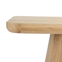 Close-up of the Langston Dining Table tabletop highlighting the rounded corner, smooth wood surface, and layered edge detail.