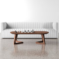 Donald oval walnut wood coffee table with angular cantilever bracket legs styled in a living room