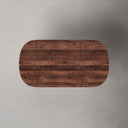 Top down view of Donald oval coffee table showing rich walnut wood grain surface texture