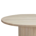 Close-up of the Casey Dining Table tabletop showing its smooth rounded edge and natural light wood grain.