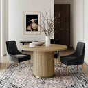 Casey 4 Seater Dining Table styled with four black upholstered dining chairs in a contemporary dining room.