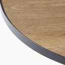 Detailed view of the Cayden Side Table tabletop highlighting its natural wood grain, rounded edge, and black rim.
