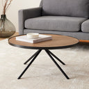 Cayden Side Table used as a low coffee table beside a gray sofa, holding books and a small bowl.