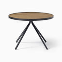 Close-up of the Cayden Side Table showing the smooth natural wood tabletop and contrasting black metal edge.