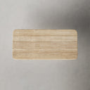 Close-up of the Landyn Dining Table tabletop showing its natural wood grain, smooth rounded edge and black tapered leg.