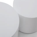 Detailed view of the two Cohen End Tables overlapping, showcasing their minimalist cylindrical silhouettes and clean white finish.