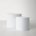 Cohen End Table nesting pair shown from the front, with two smooth white round tabletops at different heights.