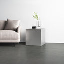 Dante modern silver finish minimalist metal cube end table styled in a room