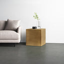 Dante modern brass finish minimalist metal cube end table styled in a room
