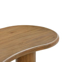 Close up angle view of Reese coffee table showing rounded tabletop edge and natural light oak wood grain cylinder leg