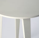 Macro view of Gideon table edge showing matte white finish texture and leg joints