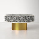 Miller round bone inlay coffee table three-quarter studio view showcasing geometric illusion pattern