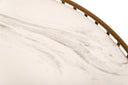 Close up view of Zain coffee table showing white marble tabletop with grey veining and gold rim