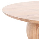 Close up angle view of Nixon coffee table showing tapered tabletop edge and warm natural wood pedestal base