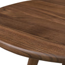Macro view of Jaden table top showing smooth walnut wood grain edge texture