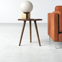 Jaden solid wood round end table with tapered tripod legs styled next to a couch