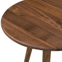 Macro view of Jaden table top from an angle showing walnut wood plank layout