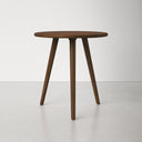 Jaden solid wood round end table with tapered tripod legs straight front studio view
