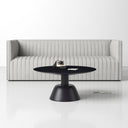 Boston round black wood coffee table with sculpted pedestal dome base styled in a living room