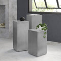 Karson brushed metal pedestal nesting tables styled in a modern room