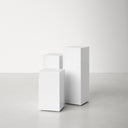 Karson 3 piece white minimalist pedestal nesting table set front studio view