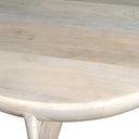 Close up angle view of Neil bowl coffee table showing curved rim profile and light mango wood tabletop grain
