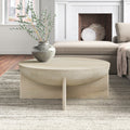 Neil round solid wood bowl coffee table with cross slab base in a living room