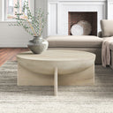 Neil round solid wood bowl coffee table with cross slab base in a living room