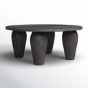 Alberto round black wood coffee table three-quarter studio view showcasing thick tapered legs