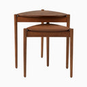 Lewis Tripod Nesting Side Tables shown together in black, with two rounded tabletops and slim cylindrical legs in a minimalist design.