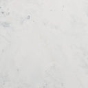 Full frame macro swatch of white Carrara marble texture with subtle grey veining on Cason coffee table