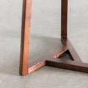 Macro view of Martin table base showing interlocking solid wood tripod stretcher joints