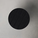Top down view of Finnley round coffee table showing charcoal black wood grain surface texture