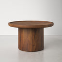 Paxton round wood pedestal coffee table side view showcasing dark walnut finish
