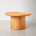 Paxton round wood pedestal coffee table low profile studio angle view