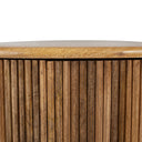 Close up straight view of Sincere coffee table top edge and vertical fluted panels