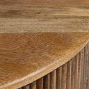 Close up angle view of Sincere coffee table showing rounded tabletop edge and fluted paneling