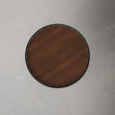 Top down view of Morgan round end table showing dark brown wood grain surface