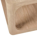 Close up corner view of Kingsley light wood coffee table showing rounded edges and open storage shelf grain