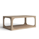 Kingsley rectangular light wood coffee table three-quarter studio view showcasing open shelf and rounded cutout frame